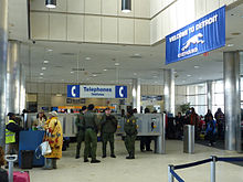 U.S. Border Patrol Agents at the Greyhound bus station in Detroit, Michigan, in February 2011. Immigration checks on trains, buses, and highways within 100 miles of the northern border have become more common. Detroit - Inside Greyhound Bus Station - P1080197.JPG