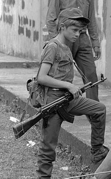 Rebel Salvadoran soldier boy combatant in Perquin, El Salvador, 1990, during the Salvadoran Civil War ERP combatants Perquin 1990 35.jpg