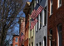 Brick rowhouses with flags