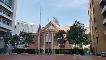 Thailand national flag flown at half-mast at a high school in Bangkok during the state mourning of the King Bhumibol Half mast Bangkok School 2016.jpg