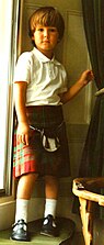 A four-year-old boy wearing a kilt and T-bar sandals in Scotland, 1987.