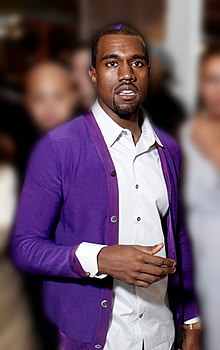 West wrote lyrics expressing an ambivalence towards his newfound wealth and fame. K. West (cropped) (blurred).jpg
