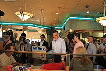 Romney speaks with patrons at a Senate Coney Island Restaurant in Livonia, Michigan, during a campaign stop, June 9, 2011. Mitt Romney at Senate Coney Island Livonia Michigan.JPG