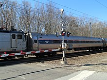 A Northeast Regional train crosses Miner Lane in Waterford, the site of a fatal accident in 2005 Northeast Regional at Miner Lane 1.JPG