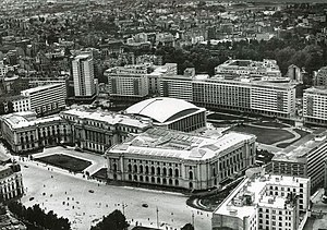 The Royal Palace from the air during Communist times within in the back the multipurpose hall 'Sala Palatului' Palace Hall complex, Bucharest, Romania, with the former Royal Palace and the Palace Hall in the center of the photo.jpg