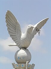 Peace dove statue in Lome, Togo, Africa. The dove and the olive branch are the most common symbols associated with peace. Peace dove (3329620077).jpg