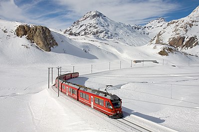 RhB ABe 8/12 "Allegra" multiple unit with a local train to Tirano in the grade between Bernina Lagalb and Ospizio Bernina.