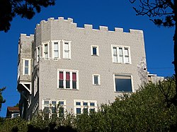 Photograph of the Roper House, a three-story, crenellated house seen from a low angle