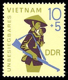 East German solidarity stamp depicting a Vietnamese mother and child with the text "Unbeatable Vietnam" Stamps of Germany (DDR) 1968, MiNr 1371.jpg