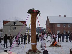 Ukrainian Rodnovers worshipping a goddess' pole on Vodokresh in the countryside. Ukrainian Rodnovers worshipping a goddess at Vodokres holiday.jpg
