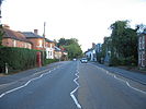 A view of the A21 high street in Hurst Green, East Sussex, UK facing towards Hastings
