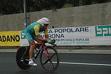 A cyclist riding a bike while in an aerodynamic position.