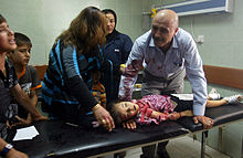 Child killed by a car bomb in Kirkuk, July 2011 Car bomb victim in Iraq.jpg