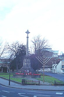 The cross of the war memorial and a menorah coexist in Oxford, Oxfordshire, England Cross menorah Oxford 20051225.jpg