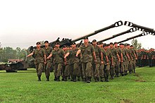 Canadian soldiers marching in their green-coloured combat uniforms, 1996 Defense.gov News Photo 960814-A-8186D-004.jpg
