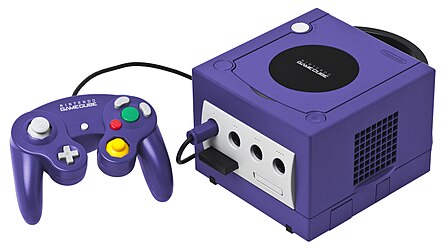 A Nintendo GameCube console shown with memory card and a standard controller