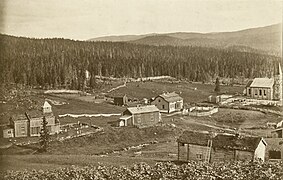 Hattfjelldal Church (1868) under construction (right hand), old church left hand.