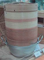 Stacked bamboo steamers on top of a pot