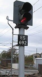Network Rail two-aspect colour-light railway signal set at danger