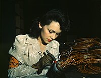 Woman aircraft worker checking assemblies. California, 1942. World War II woman aircraft worker, Vega Aircraft Corporation, Burbank, California 1942.jpg