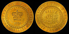 Gold coin with a crown on one side and the denomination of one pound on the other