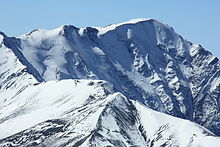 Mount Bazarduzu, the highest peak of Azerbaijan, as seen from Mount Shahdagh Bazarduzu detail.JPG