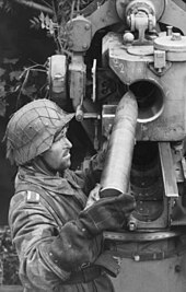 German artilleryman loading a round into an 8.8 cm Flak 36 or 37 Bundesarchiv Bild 101I-496-3491-36, Frankreich, Flak-Geschutz.jpg