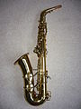 Left side view of Conn 6M "Lady Face" alto saxophone showing distinctive underslung octave key