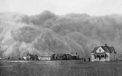 A dust storm covers homes (Texas, 1935)
