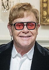 In 2024, Elton John became the nineteenth person to win all four awards. Elton John 2022.jpg