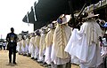 Masquerades of the Eyo Iga Faji parading in the TBS.