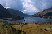 a tower by a lake in the Scottish Highlands