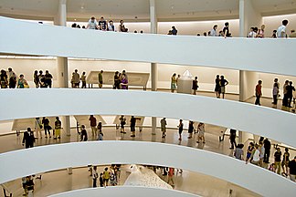 An interior view of the museum on a busy day Guggenheim flw show.jpg