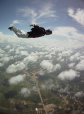 A jumper in free-fall in Venezuela with his parachute on his back HIGUEROTE DESDE EL AIRE.png