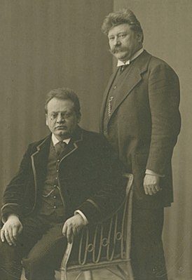 Георг Хюттнер (стоит) с Максом Регером (1909)