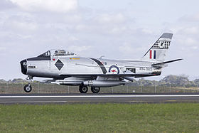 Single-engined military jet parked on tarmac