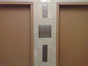 Photo of outside elevator doors and wall colum...