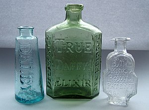 Photograph of three antique patent medicine bo...