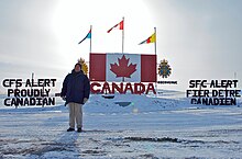 U.S. Ambassador David Jacobson in front of CFS Alert welcome sign Ambassador Jacobson in Alert, Nunavut.jpg