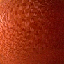 A close-up of a textured orange ball