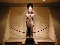 Amenhotep III standing upon Sled of God Tem (oldest creator god Atum)