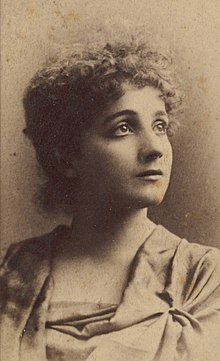 Bust-length photographic portrait, looking up to her left, of Edith Morgan Gellibrand