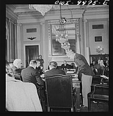 Students witness a hearing of the Naval Affairs Committee. Senator Walsh, chairman, can be seen in the background