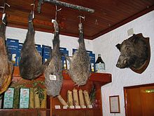Wild boar haunches and trophy, Umbria, Italy Wild Boar shop.jpg