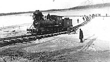 An Alaska Railroad steam locomotive crossing the Tanana River on the ice at Nenana just prior to completion of the railroad in 1923. Alaska Railroad engine crossing the Tanana River on the ice at Nenana just prior to completion of the railroad.jpg