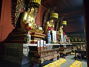 The statues of Bhaisajyaguru (right), Gautama Buddha (middle) and Amitābha (left) at Zhusheng Temple.