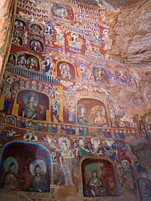 Northern Wei murals and painted figurines from the Yungang Grottoes, dated 5th to 6th centuries. Buddhist paintings Yungang.jpg