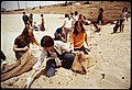 Eighth grade girls picking up the beach during recess, 1972