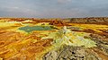 Image 17 Dallol Photograph credit: Alexander Savin Dallol is a cinder-cone volcano in the Danakil Depression, northeast of the Erta Ale Range in Ethiopia. The area lies up to 120 m (390 ft) below sea level, and has been repeatedly flooded in the past when waters from the Red Sea have inundated it. The Danakil Depression is one of the hottest places on Earth, and the evaporation of seawater after these flooding episodes produced thick deposits of salt, as seen in this landscape. The deposits at Dallol include significant quantities of the carbonate, sulfate and chloride salts of sodium, potassium, calcium and magnesium. Hot springs discharge brine to form the blueish ponds, and small, temporary geysers produce cones of salt. More selected pictures