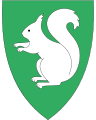4214 Froland I grønt et sølv ekorn [206] Symboliserer skogsdrift.